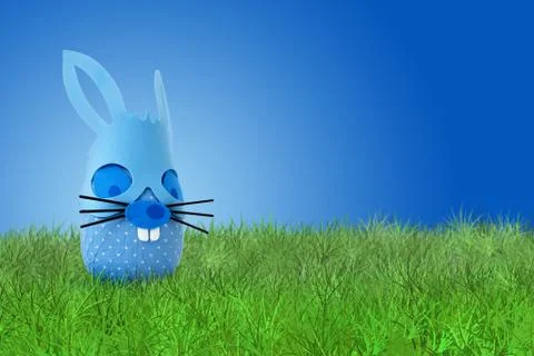Funny Easter blue bunny on grass Stock Photos