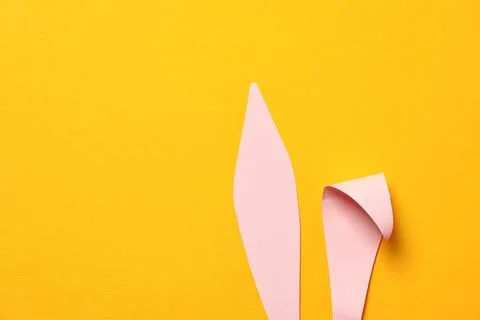 Funny Easter bunny ears on color background, top view with space for text 스톡 사진
