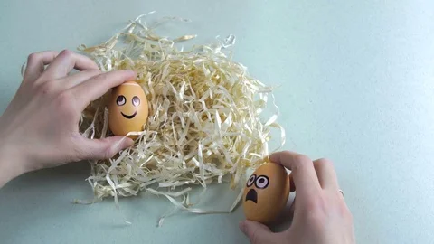 Funny Easter eggs with drawn faces depicting various emotions lying and Stock Footage