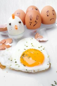 Funny egg faces with daring of sad emotions afraid of cooking Stock Photos