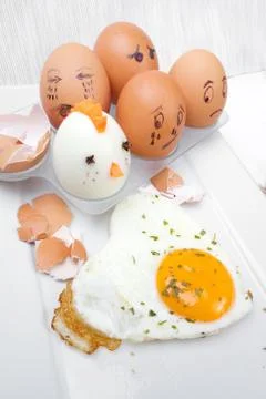 Funny egg faces with daring of sad emotions afraid of cooking Stock Photos
