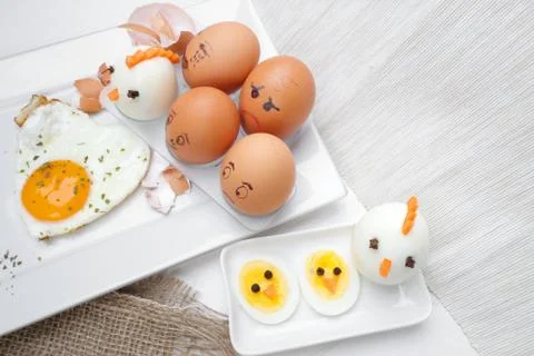 Funny egg faces with daring of sad emotions afraid of cooking Stock Photos