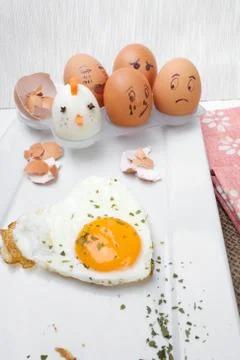 Funny egg faces with daring of sad emotions afraid of cooking Stock Photos