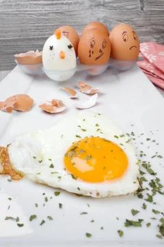 Funny egg faces with daring of sad emotions afraid of cooking Stock Photos
