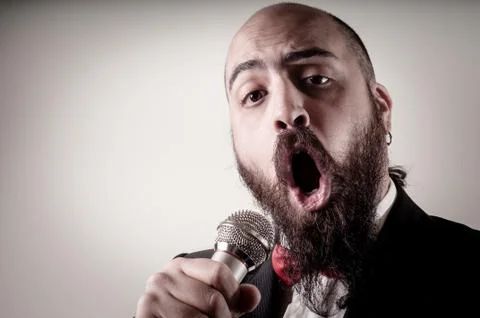 Funny elegant singer bearded Stock Photos