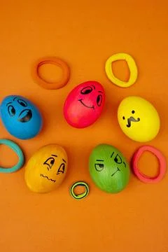 Funny Emoji Easter Eggs On Vibrant Orange Background Stock Photos