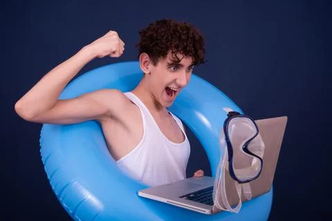 Funny emotions of an attractive guy. Blue background. Stock Photos