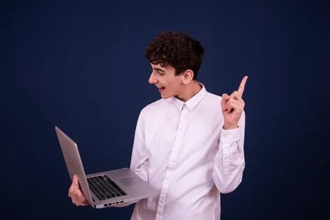 Funny emotions of an attractive guy. Blue background. Stock Photos