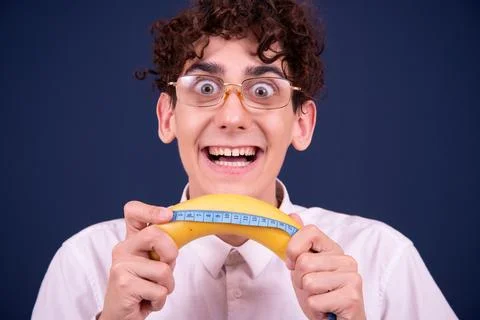 Funny emotions of an attractive guy. Blue background. Stock-Fotos