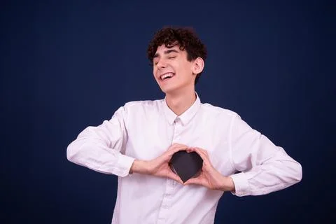 Funny emotions of an attractive guy. Blue background. Foto stock
