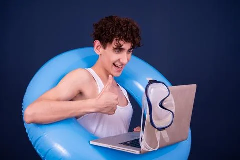 Funny emotions of an attractive guy. Blue background. Stock Photos