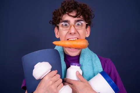Funny emotions of an attractive guy. Blue background. Stock Photos