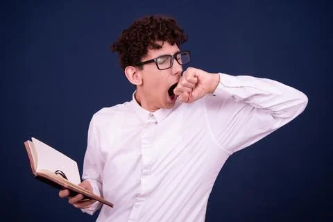 Funny emotions of an attractive guy. Blue background. Stock Photos