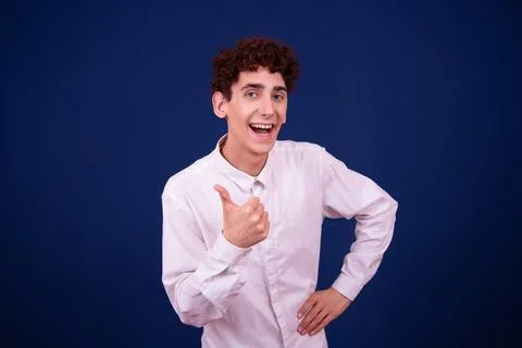 Funny emotions of an attractive guy. Blue background. Stock Photos