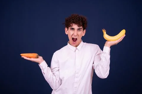 Funny emotions of an attractive guy. Blue background. Stock Photos