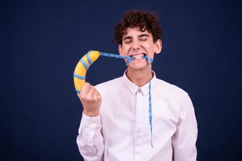 Funny emotions of an attractive guy. Blue background. Stock Photos