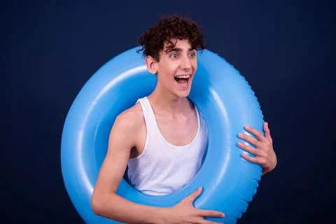 Funny emotions of an attractive guy. Blue background. Foto stock