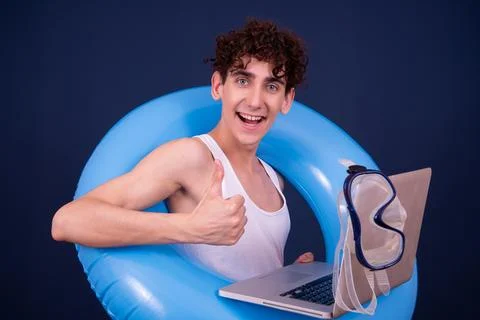 Funny emotions of an attractive guy. Blue background. Stock Photos
