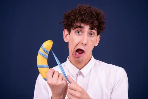 Funny emotions of an attractive guy. Blue background. Stock Photos