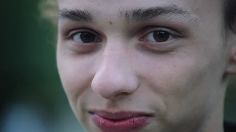 Funny face closeup , young boy outdoors in the evening 動画素材 96217033