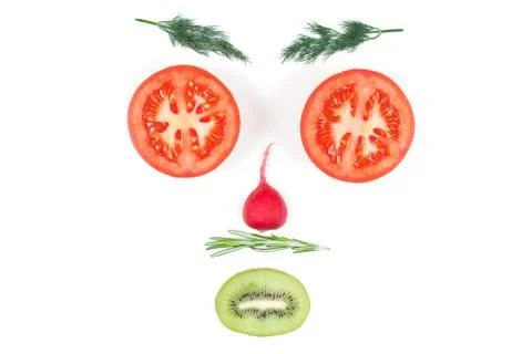 Funny face from different vegetables tomatoes, cucumber, radish, dill and ros Stock Photos