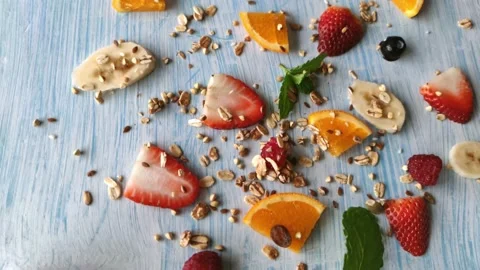 Funny face made out of toast decorated with berries and fruits Stock Footage 160942593