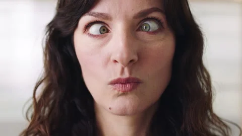 Funny face, pout and squint with silly woman in studio for comedy, goofy Stock Footage 331415881