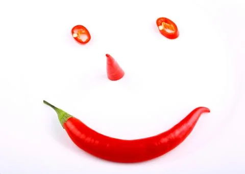 Funny face red hot pepper on a plate Stock Photos