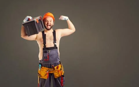 Funny fat bearded builder with a tool box. 스톡 사진