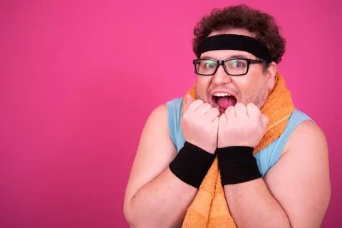 Funny fat man eats donuts. Retro style. Food and fitness. Stock Photos