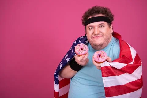 Funny fat man eats donuts. Retro style. Food and fitness. Stock Photos