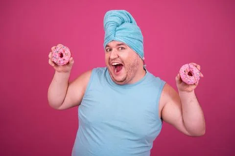 Funny fat man eats donuts. Retro style. Food and fitness. Stock Photos