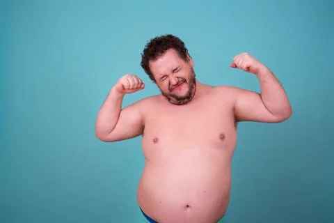 Funny fat man goes in for sports and eats right. Stock Photos