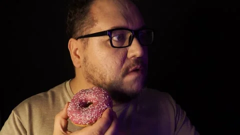 Funny fat man watching TV and eating Stock Video Pond5