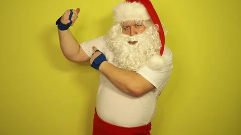 Funny fat Santa Claus doing fitness. Stock Footage 296108738