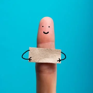 Funny finger holding blank bunner showing on it and smiling Stock Photos