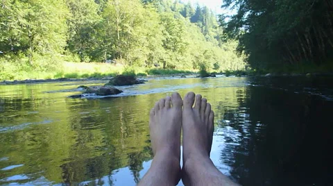 Funny Floating Feet Down River Stock Footage 40443890