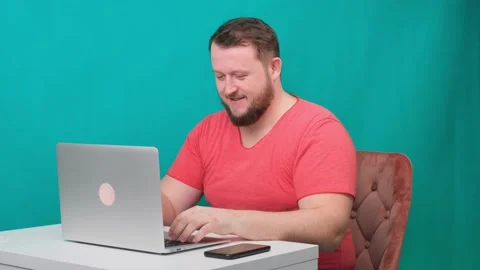Funny frames of male using laptop. man working on a computer pretending to be a Stock Footage 131110186