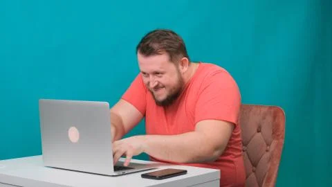 Funny frames of male using laptop. man working on a computer pretending to be a Stock Photos