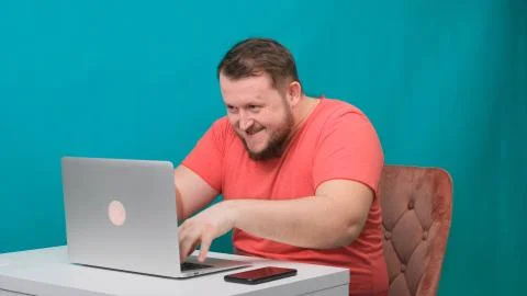 Funny frames of male using laptop. man working on a computer pretending to be a Stock Photos