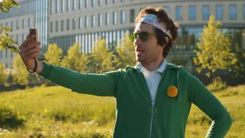 Funny freak man looking at himself in smart phone Stock Footage 133969379