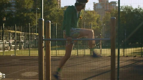 Funny freak man pushing up on parallel bars Stock-Footage 133955699
