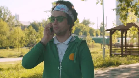 Funny freak man talking by smart phone Video stock 133970348