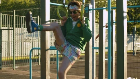 Funny freak pulling up on the rings Stock Footage 133951721