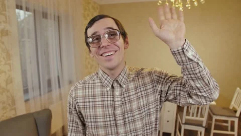Funny friendly nerd waving his hand Stock Footage 145017028