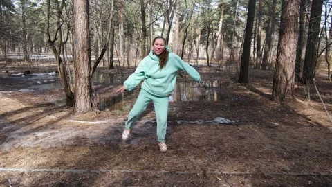 Funny girl dancing in the forest Video stock 182058090