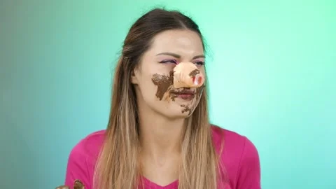 Funny girl dressed as a pig eats chocolate. Stock Footage 166602659