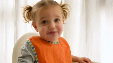 Funny girl looking at camera during lunch Stock-Footage 129290386