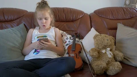 Funny girl with a smartphone Stock Footage