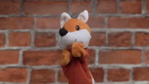 Funny glove fox over brick background Stock Footage 79058357